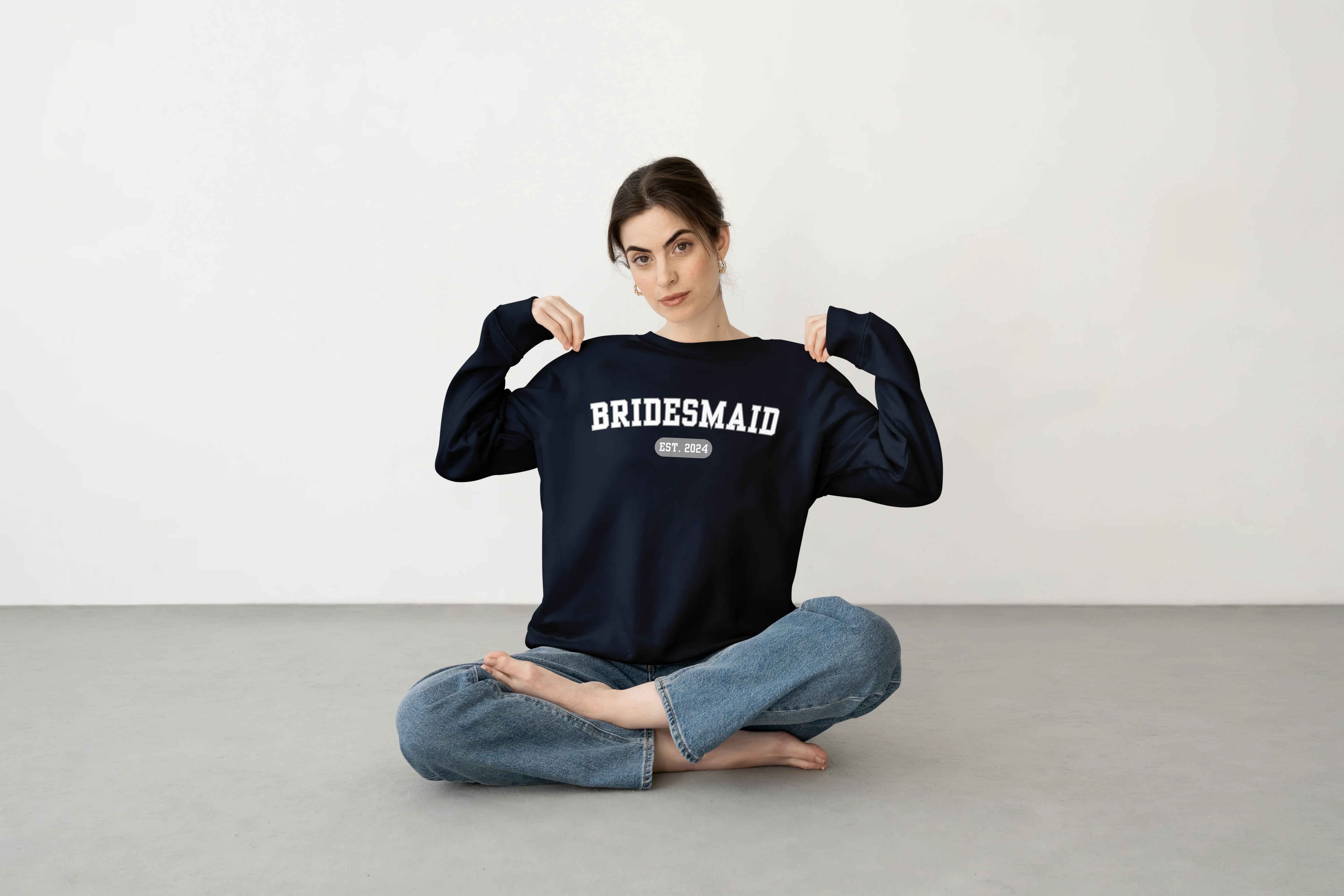 woman wearing a crewneck bridesmaid sweatshirt