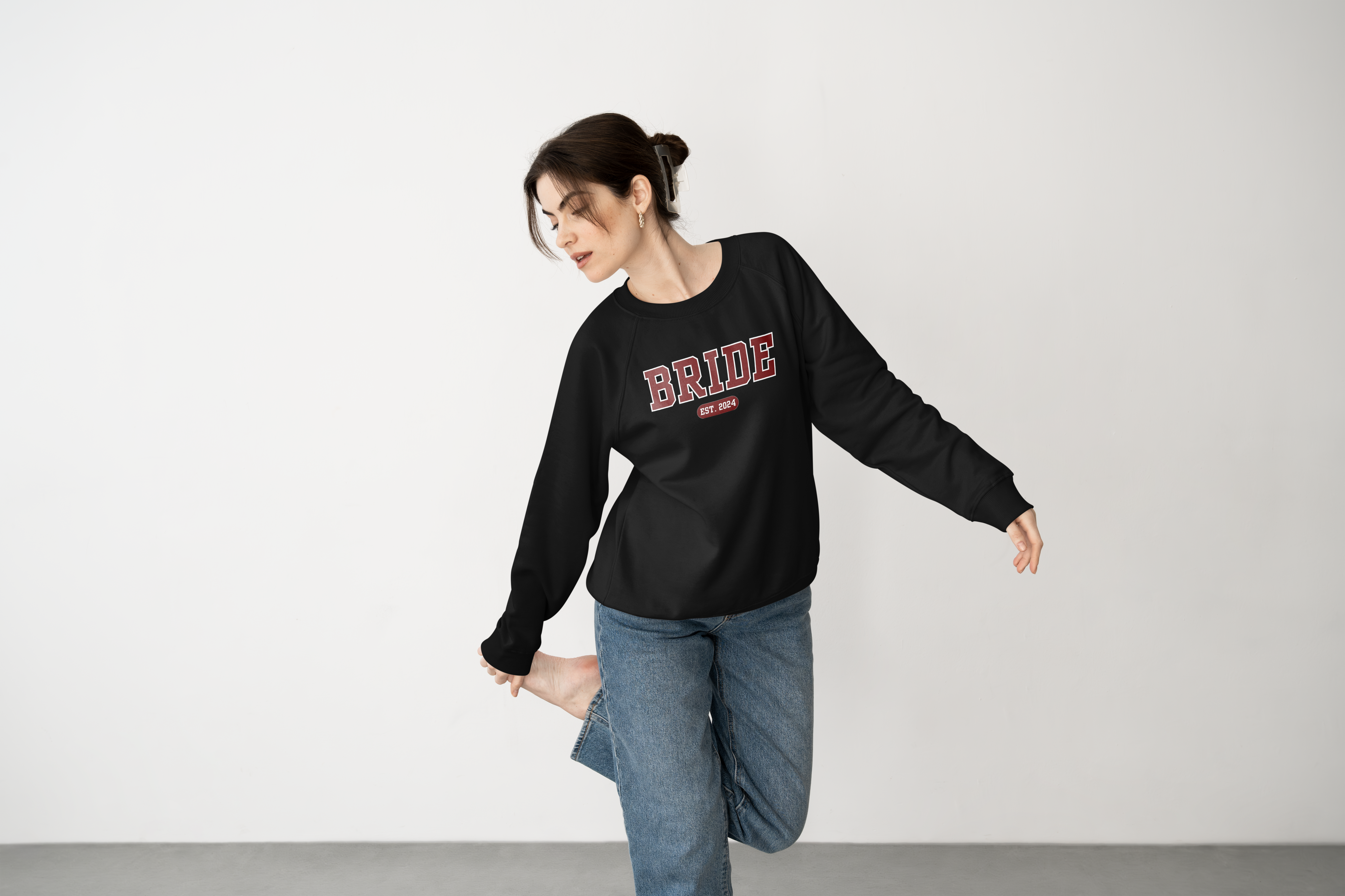 woman wearing a white, embroidered bride sweatshirt