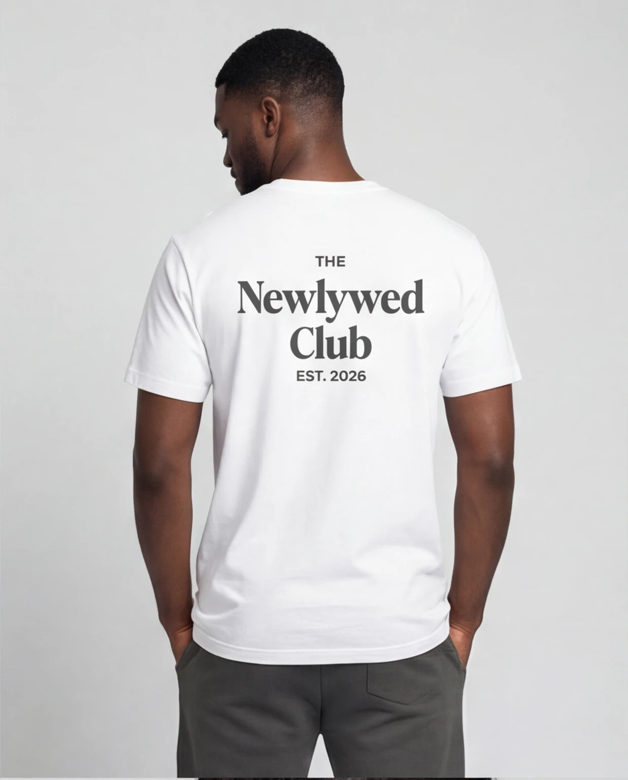 Model wearing Newlywed Club T-Shirt - Charcoal Logo