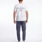 Model wearing Newlywed Club T-Shirt - Slate Blue Logo
