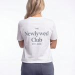 Model wearing Newlywed Club T-Shirt - Slate Blue Logo