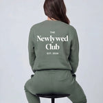 Model wearing Newlywed Club Crew Neck Sweatshirt - Alpine Green