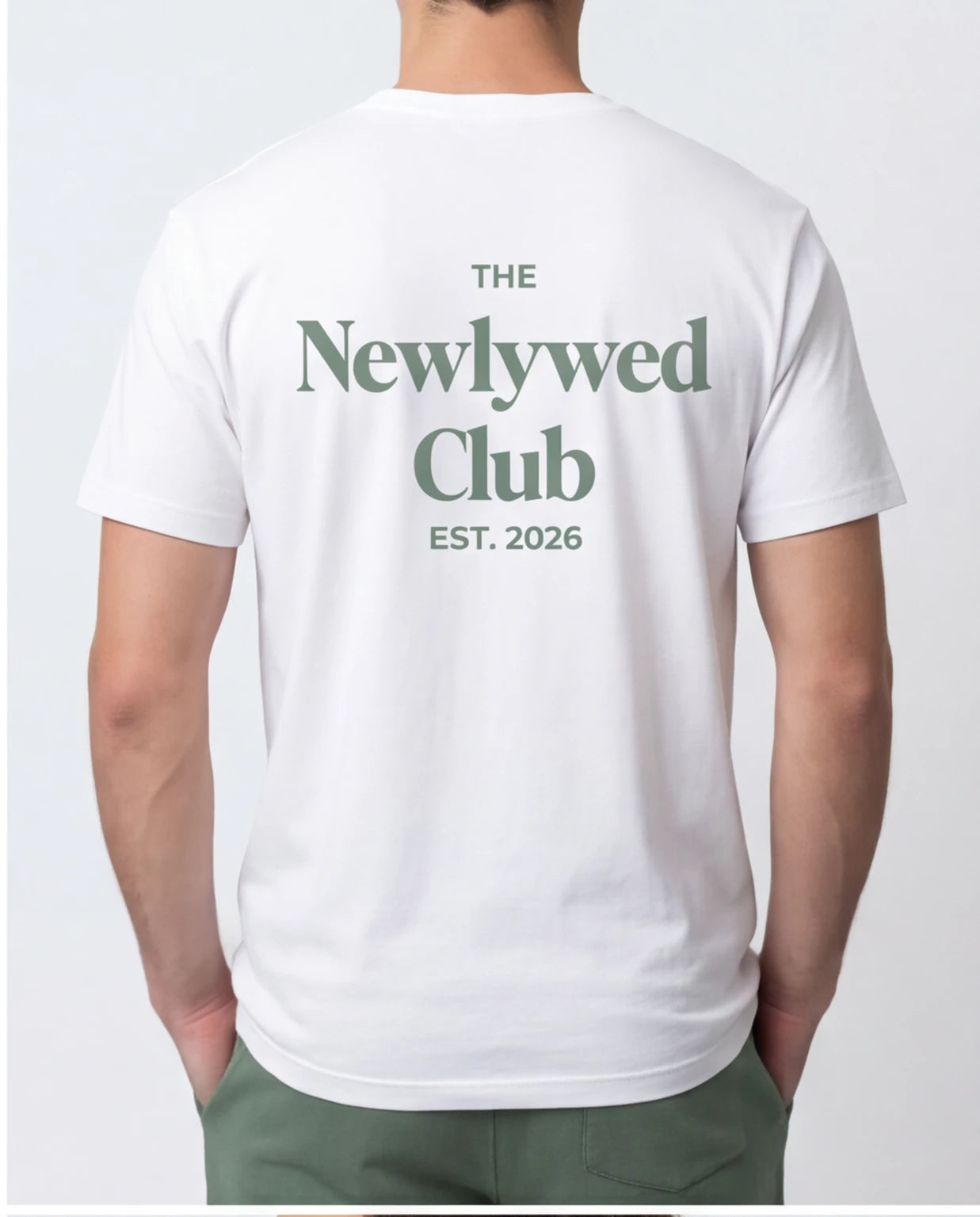Model wearing Newlywed Club T-Shirt - Alpine Green Logo